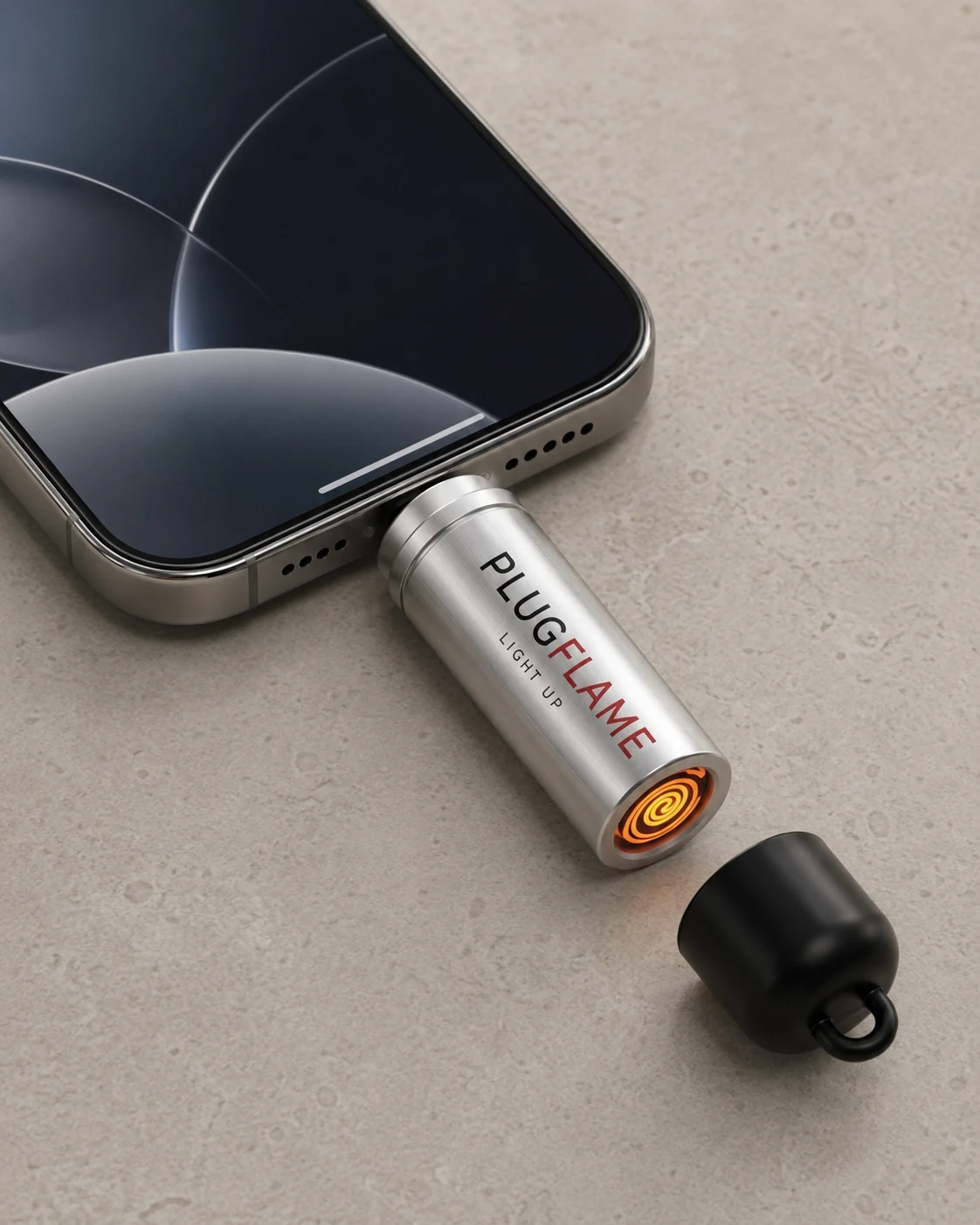 PlugFlame next to a USB-C iPhone with glowing tungsten coil